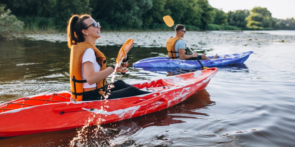 Couple together kayaking on the river